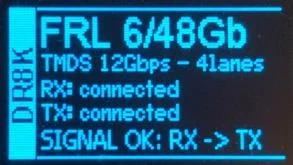 DR HDMI 8K OLED signal status page confirming an established HDMI link, with the negotiated link rate shown on the display